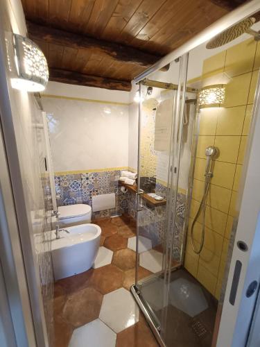 a bathroom with a shower and a toilet and a sink at Capocampo Amalfi Coast in Tramonti