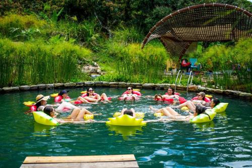 a group of people in the water in rubber boats at Cultivarte in Anapoima