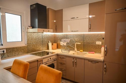 a kitchen with a sink and a counter top at Beach Walk Apartments in Ulcinj