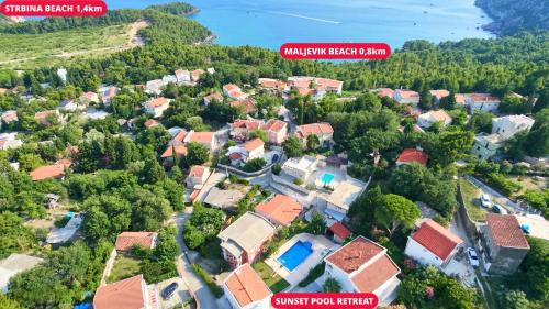 an aerial view of a residential neighbourhood with houses at Sunset Pool Retreat in Zagrađe