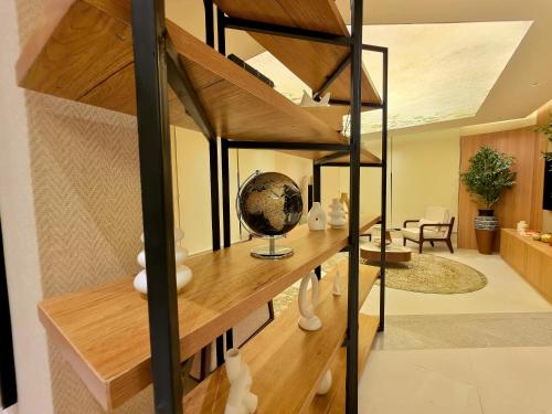 a room with a loft bed with a desk at Amazonia Luxury in Abuja