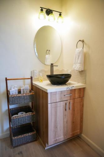 a bathroom with a sink and a mirror at Dome on the Range in Duchesne