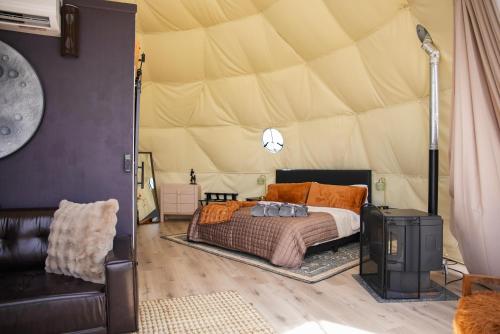a bedroom with a bed in a tent at Dome on the Range in Duchesne