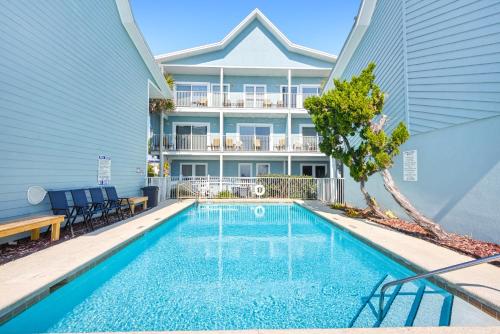 a swimming pool in front of a building at Sea Oats Motel in Destin