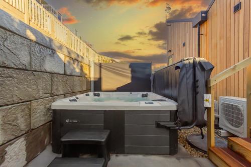 a bathroom with a bath tub in a building at Roam Taupo Lake Front Unit 2 - Spa Pool in Taupo