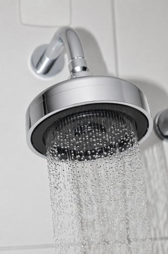 a shower head with water pouring out of it at Treville Hotel in Caràzinho