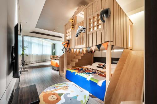 a childs bedroom with a bunk bed and a staircase at Xi'an Jing - Scenery Hotel in Xi'an