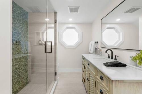 a bathroom with a shower and a sink at Blanco Bay Key in Duck Key