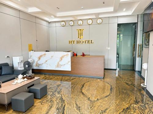 a hotel lobby with a lift hotel sign on the wall at HT Hotel Hà Tĩnh in Hà Tĩnh