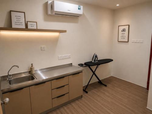 a kitchen with a sink and a counter top at Citto Inn Bangi in Bandar Baru Bangi