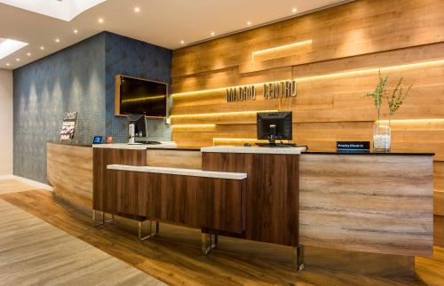 a lobby of a hotel with a reception desk at Hotel Madrid Centro, Affiliated by Meliá in Madrid