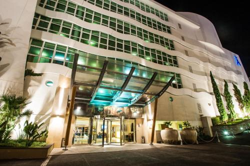 a large building with blue lights on it at Meliá Madeira Mare in Funchal