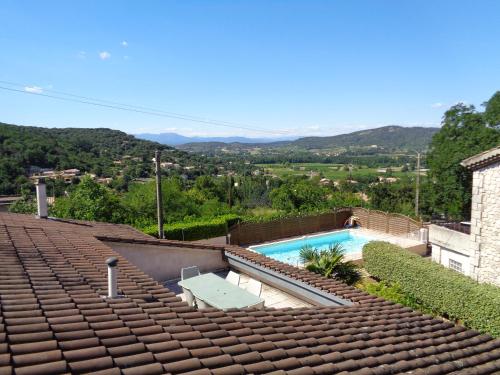 a roof of a house with a swimming pool at Gîtes Le Mas du Vieux Chêne in Salavas