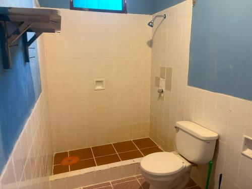 a bathroom with a toilet and a shower at Welcome to the Amazon in Iquitos