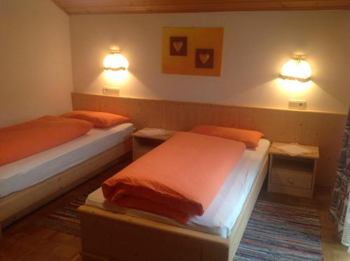 A bed or beds in a room at Ciasa Orzun