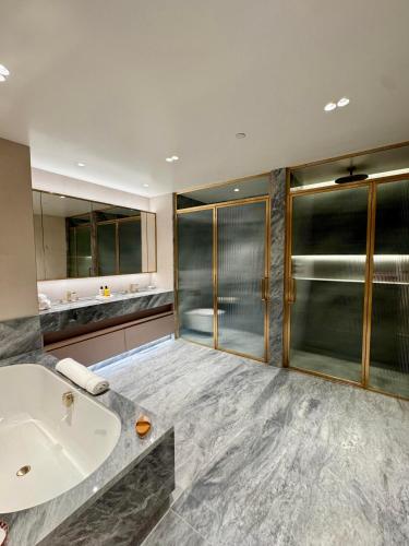 a bathroom with a sink and a shower at Filmores Hotel in Toronto