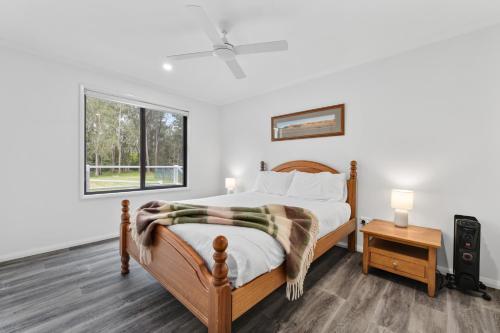 a bedroom with a bed and a window at Native Retreat - Tranquil Seaham Escape in Seaham