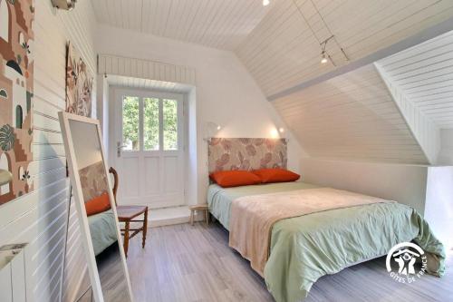 a bedroom with a bed in a attic at Ty venoux in Elven