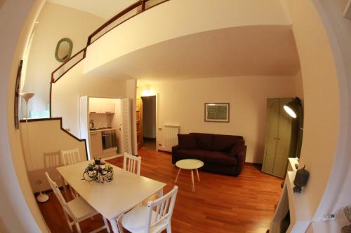 a living room with a table and a couch at Palazzo Velli Suites in Rome