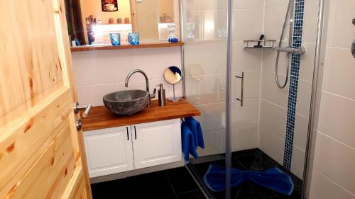 a bathroom with a sink and a shower at Ferienwohnung Zirbenduft in Inzell