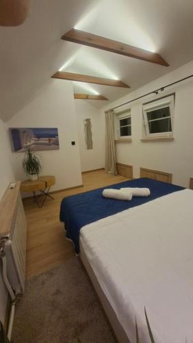 a bedroom with a large bed in a room at Polana Jabłonka in Jabłonka