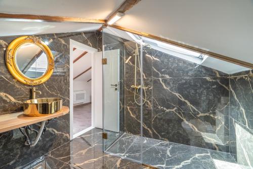 a bathroom with a shower and a mirror at Agis Luxury House in Lefkada