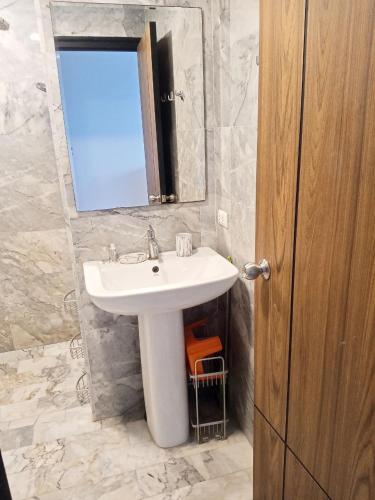 a bathroom with a sink and a mirror at Vacation by the ocean in Phuket