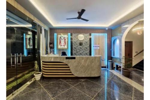 a lobby with a reception desk in a building at FabHotel The Crystal in Udaipur
