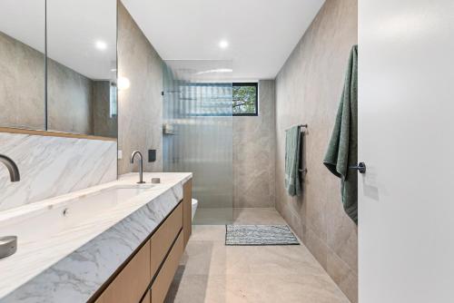 a bathroom with a sink and a shower at Brighton Beach Terrace in Melbourne