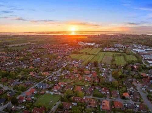 an aerial view of a city at sunset at FroschKönig in Norden