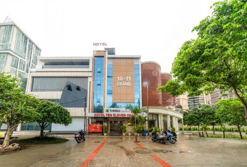 a building with motorcycles parked in front of it at Treebo Ten Eleven Grand, Scheme 78 in Indore