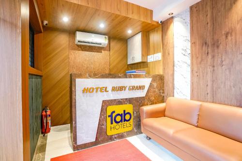 a lobby of a hotel lobby candy store with a couch at FabHotel Ruby Grand in Mumbai