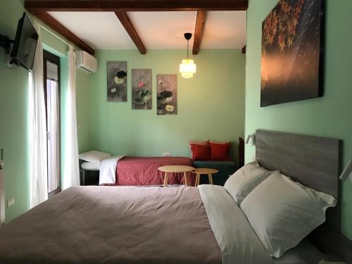 a bedroom with a bed and a table in it at Casa Vacanza Finalmente in SantʼAngelo le Fratte