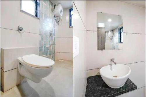 a bathroom with a toilet and a sink at FabHotel Bhagyashri Executive in Nashik