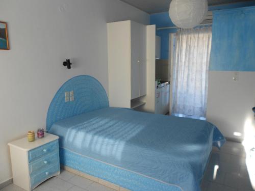 Postel nebo postele na pokoji v ubytování Blue White House