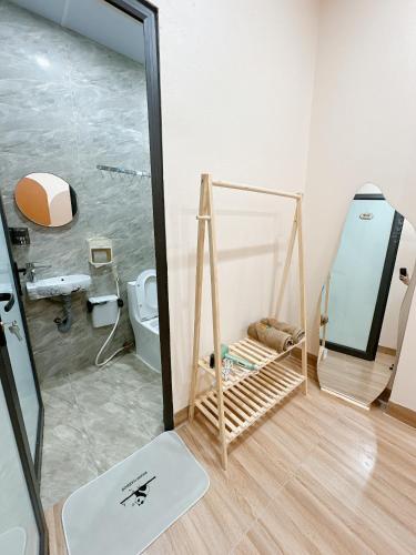 a bathroom with a shower and a toilet at A2 House Cát Bà in Cat Ba