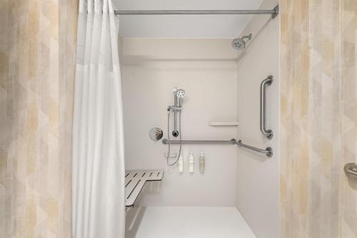a bathroom with a shower with a shower curtain at Hampton Inn By Hilton Lawrenceburg in Lawrenceburg
