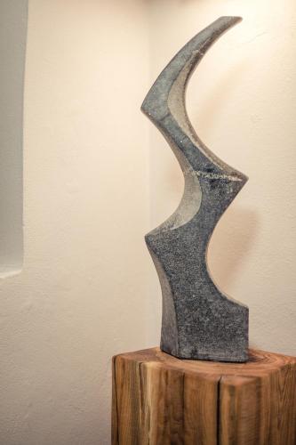 a metal sculpture sitting on top of a wooden table at Luxury Apartments No. 91 in Český Krumlov