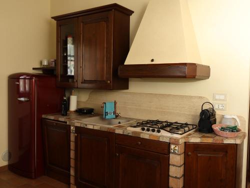 a kitchen with a sink and a stove top oven at PanElios Borgo Vacanze in Città della Pieve