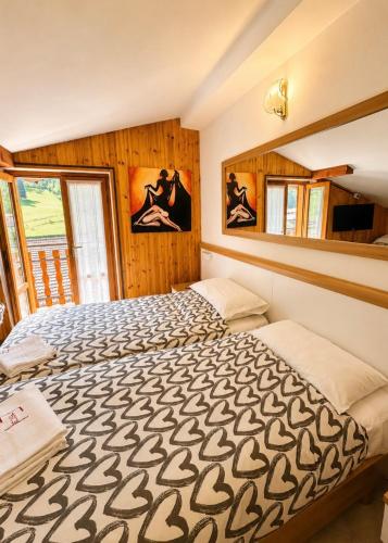 a bedroom with a large bed in a room at La Scaletta in San Colombano
