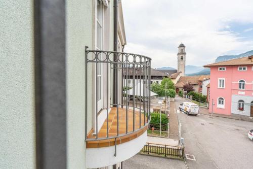 a balcony of a building with a view of a street at Casa Cataleya, Tuenno Ospitar in Tuenno