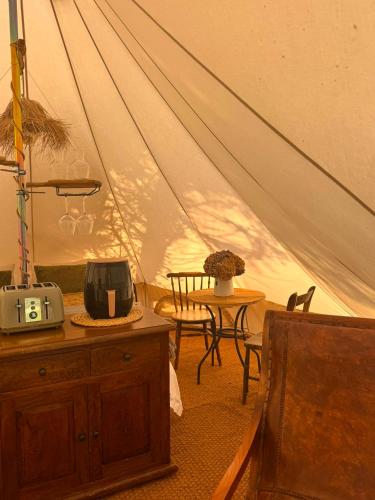 a room with a tent with a table and a chair at The Pip and Lantern in Rye