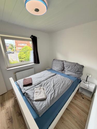 a bedroom with a bed in a small room at Room in Rendsburg in Rendsburg