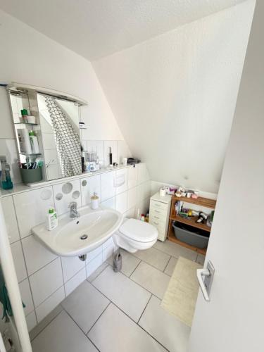 a bathroom with a sink and a toilet at Room in Rendsburg in Rendsburg