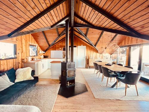 a living room with a couch and a table in a house at Chalet - Kleines Paradies - in Appenzell