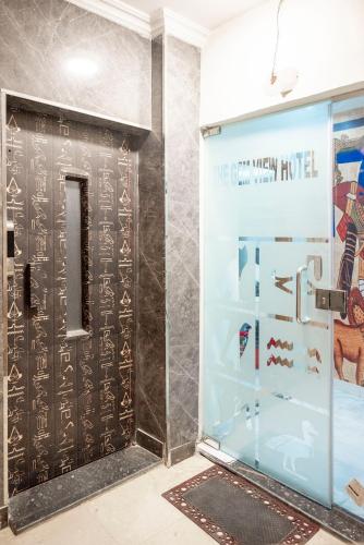 a room with a door with a sign on it at Gem View Grand Boutique in Cairo