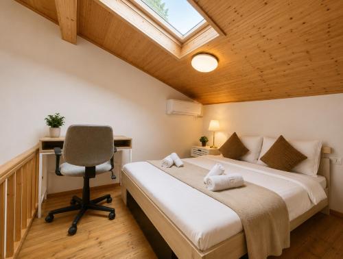 a bedroom with a bed and a desk and a chair at AFY STAYS Boutique Apartments in Bucharest