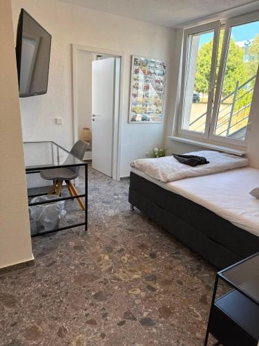 En eller flere senge i et værelse på Leingarten Studios