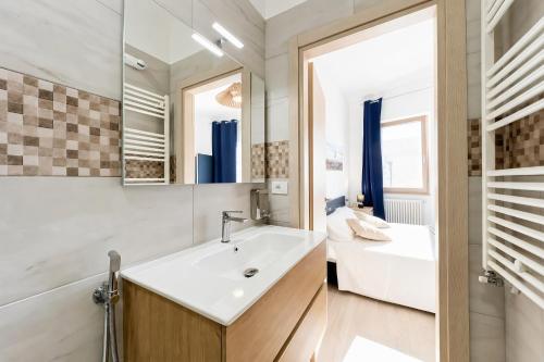 a bathroom with a sink and a mirror at Domus dell'Angelo in Monte SantʼAngelo