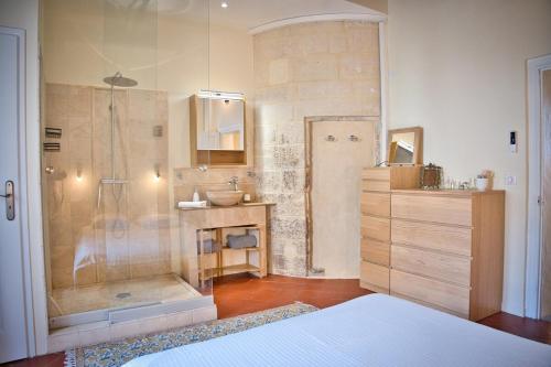 a bathroom with a shower and a sink at Elegant apartment with balcony - Maison Comte in Uzès